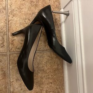 Black Cole Haan pumps. Size 10.5. Worn once indoors. See pics for minor wear